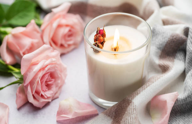Aromatic candle on the table. Soy candles in a jar. Aromatherapy and relax in spa and home. Still life.